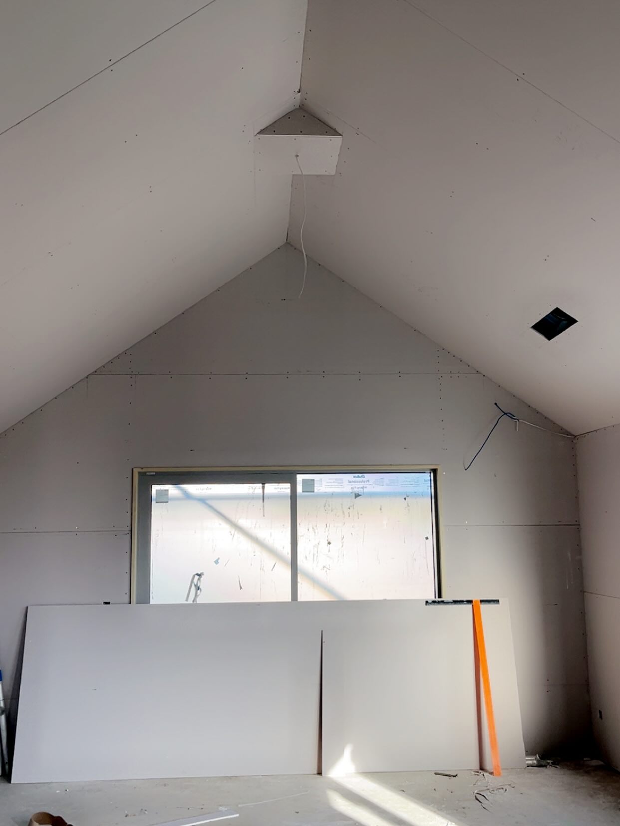 Completed vaulted-ceiling room lined and ready for stopping